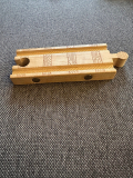What are the metal spots on this wooden railroad toy for?