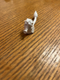 Can you help me identify this toy? I found it in assorted toys from my childhood in the 2000s. It’s a short, white, alien-looking figure with a long snout like a pig and a very long tail. It reminds me of Alf.