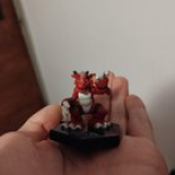 This is a Growlmon toy/mini figurine. I’ve only been able to find others with just the plastic figurine itself, but not the base, which is what interests me. Can anybody help "figure" out what’s up with that base?