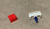 Found in my Lego bin, 2 by 2 brick for comparison, I remember this being part of some off brand Lego alien ship.