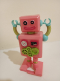 Can you help me identify this pink windup robot?