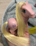 does anyone know how to straighten tinsel hair on a pony? :)